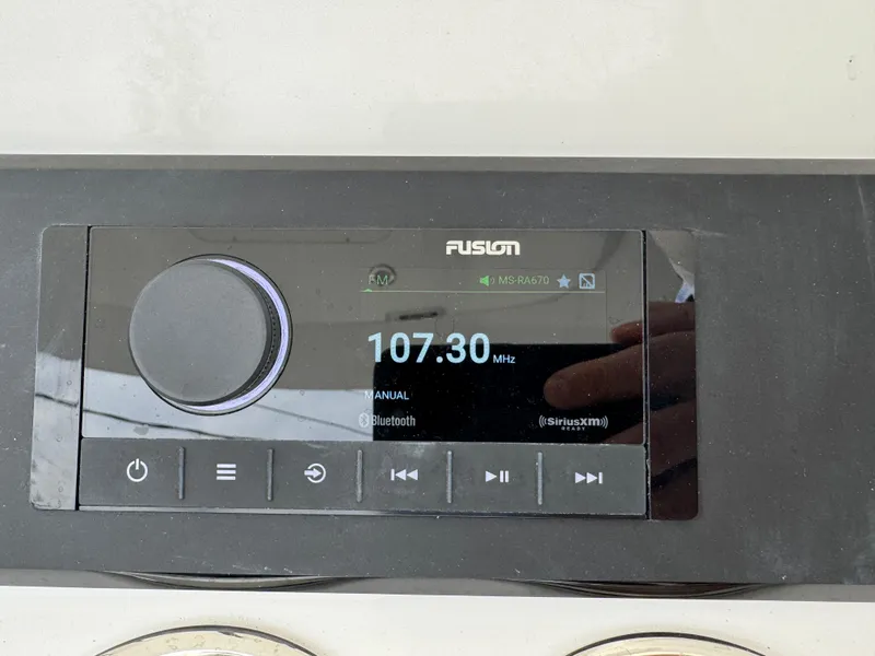 Slide: The Image of Garmin marine radio on 2025 Regulator 23 boat dashboard. - 8