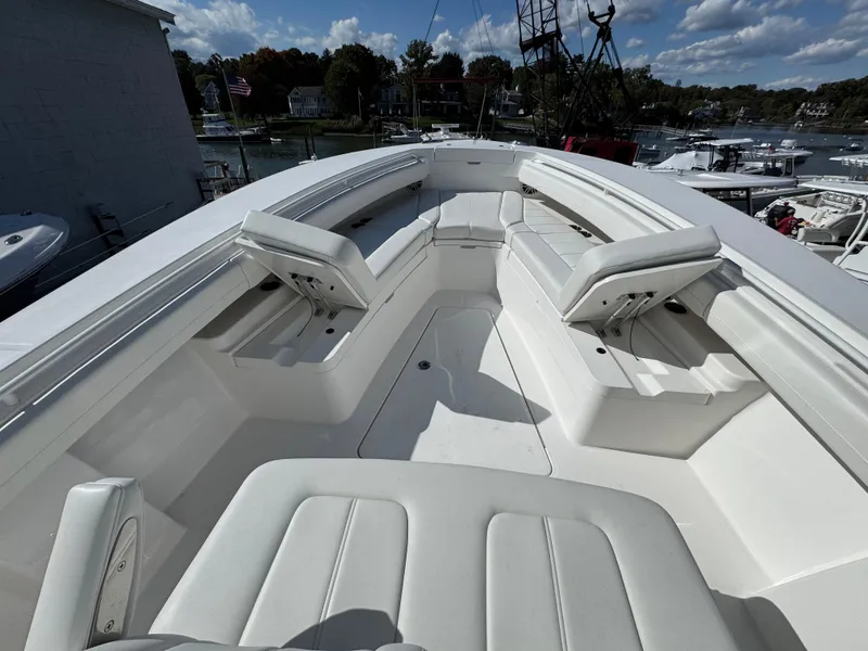 Slide: The Image of 2025 Regulator 28 boat with spacious white seating and sleek design. - 16