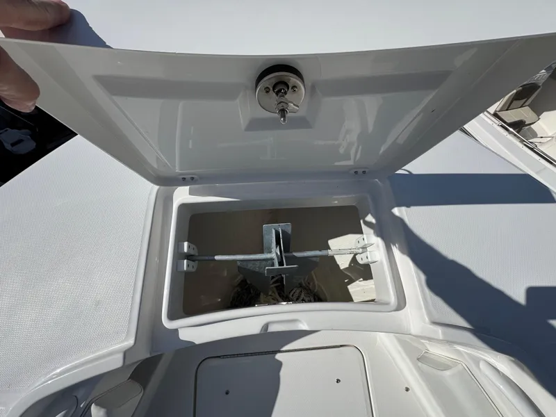 Slide: The Image of 2025 Regulator 28 boat anchor compartment with open hatch. - 17