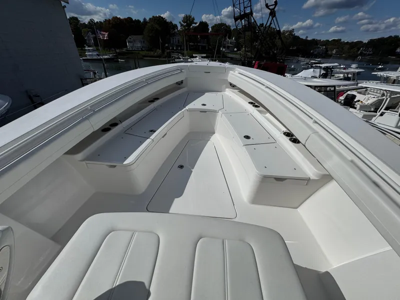 Slide: The Image of 2025 Regulator 28 boat interior with white seating and storage compartments. - 3