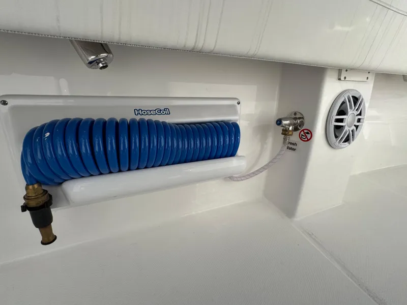 Slide: The Image of Regulator 28 boat, 2025 model, featuring HoseCoil system and speaker. - 5