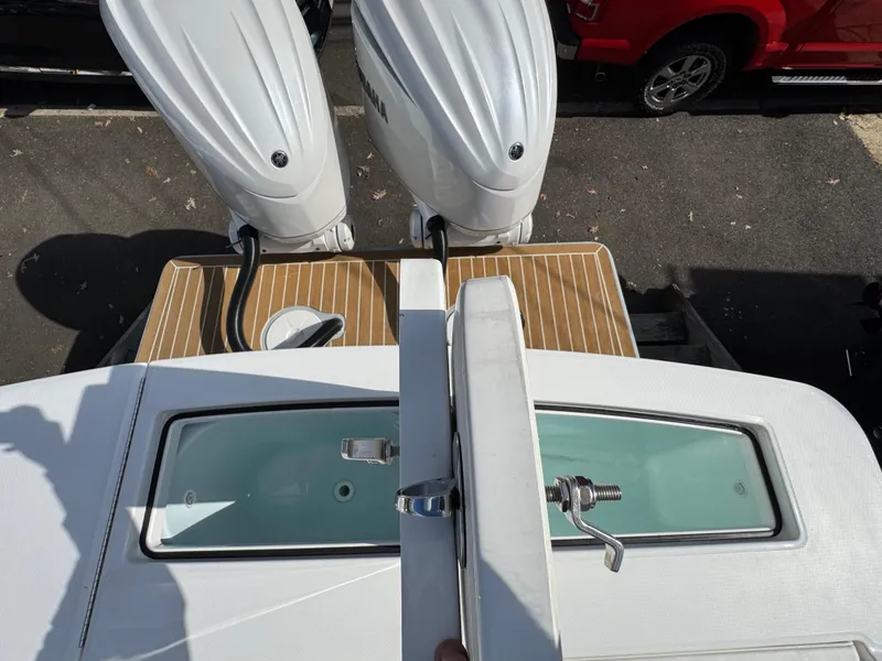 Slide: The Image of Top view of 2025 Regulator 28 boat with twin outboard engines. - 7