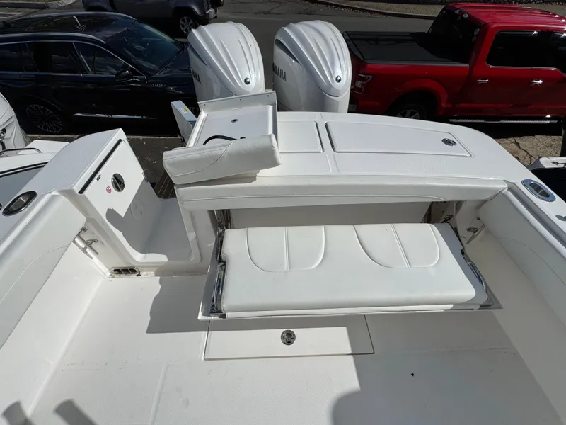 Slide: The Image of 2025 Regulator 28 boat with foldable seating and dual Yamaha engines. - 8