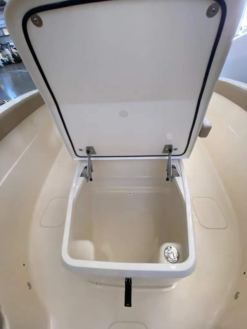 Slide: The Image of Open storage compartment on 2025 Scout 260 LXF boat. - 13