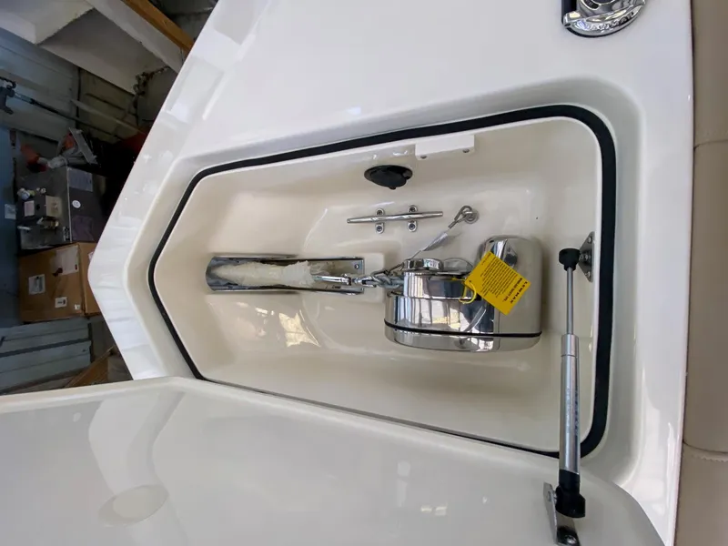Slide: The Image of 2025 Scout 260 LXF boat anchor compartment with stainless steel fittings. - 16