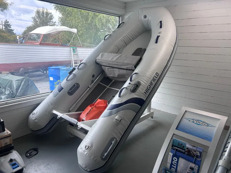 The Image of 2024 Highfield Ultralite 310 inflatable boat displayed indoors. - 0