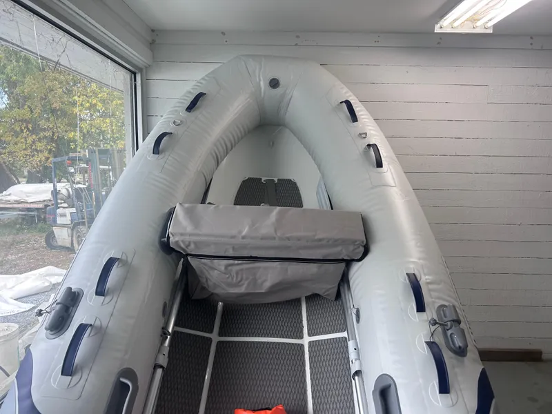 Slide: The Image of 2024 Highfield Ultralite 310 inflatable boat in showroom. - 3