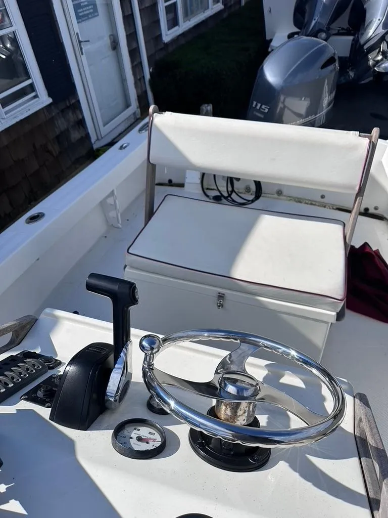 Slide: The Image of 2019 Seaway 18 Sportsman boat interior with steering wheel and seating. - 6