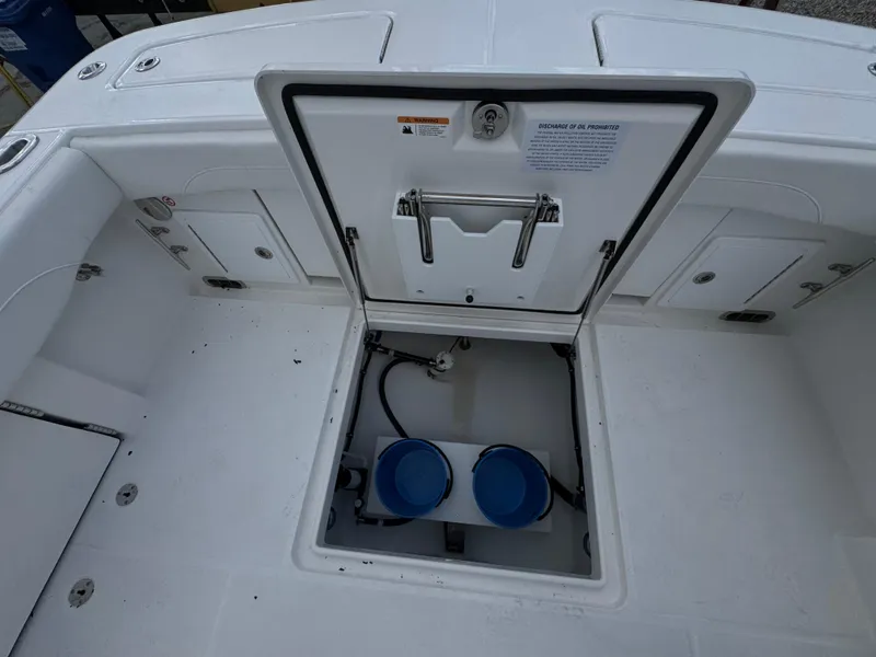 Slide: The Image of 2025 Regulator 31 boat deck with open storage compartment. - 10