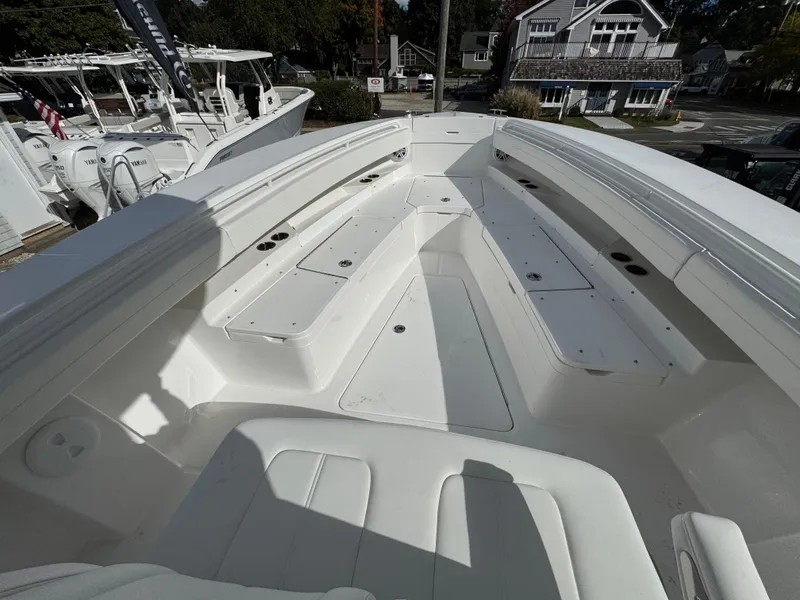 Slide: The Image of 2025 Regulator 31 boat interior with spacious seating and storage compartments. - 15