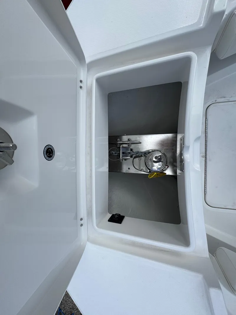 Slide: The Image of 2025 Regulator 31 boat storage compartment with stainless steel fittings. - 17