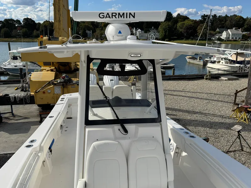 Slide: The Image of 2025 Regulator 31 boat with Garmin radar, docked at a marina. - 21