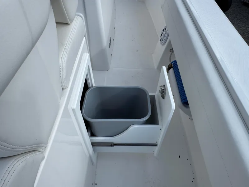 Slide: The Image of 2025 Regulator 31 boat with built-in storage compartment and trash bin. - 23
