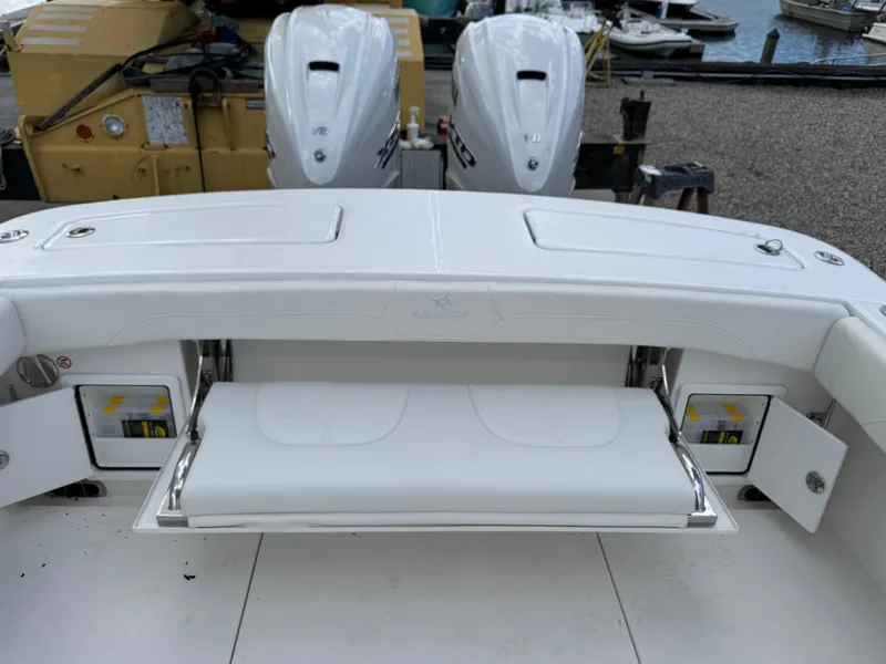Slide: The Image of 2025 Regulator 31 boat with dual engines and foldable seating. - 7