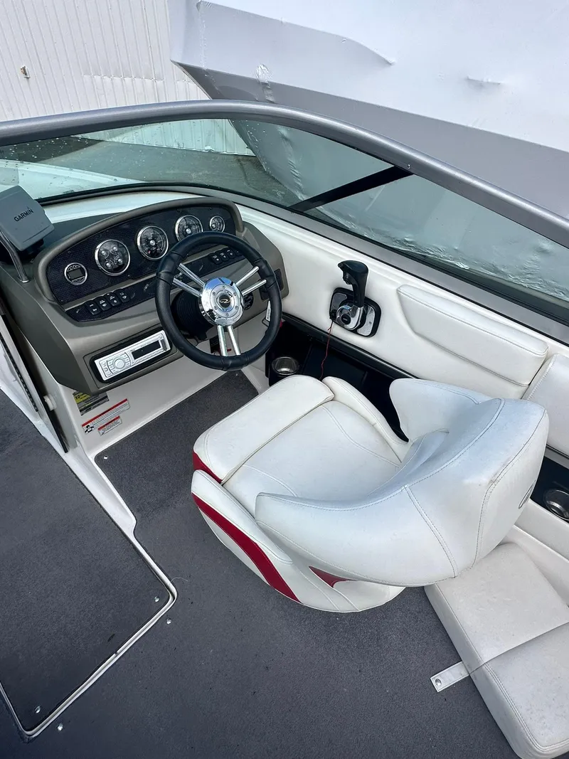 Slide: The Image of 2011 Regal 2100 Bowrider interior with steering wheel and dashboard controls. - 11