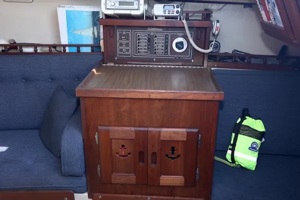 Slide: The Image of Interior of 1983 Catalina 30 sailboat with navigation station and wooden cabinetry. - 12