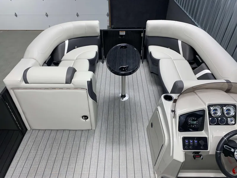 Slide: The Image of 2025 Sylvan Mirage X3 CLZ DH Tritoon interior with plush seating and modern dashboard. - 11