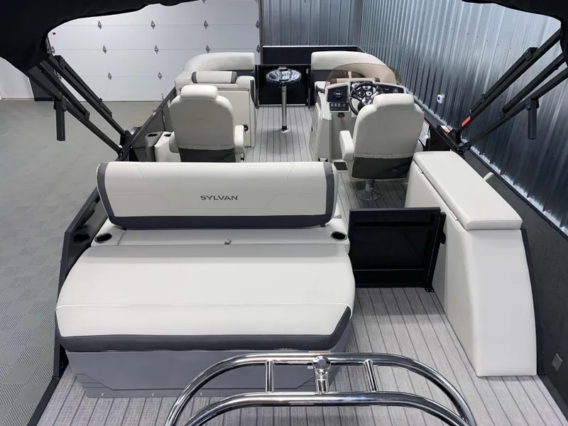 Slide: The Image of 2025 Sylvan Mirage X3 CLZ DH Tritoon interior with Mercury 150HP engine, luxury seating. - 3