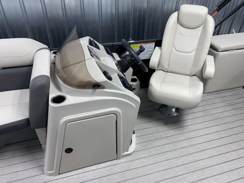 Slide: The Image of 2025 Sylvan Mirage X3 CLZ DH Tritoon interior with captain's chair and console. - 7