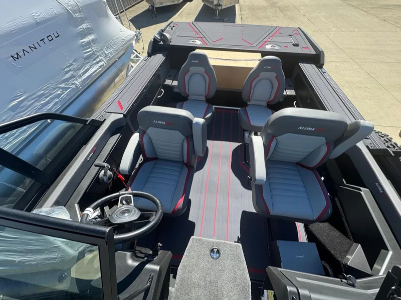 Slide: The Image of 2025 Alumacraft Trophy 185X SC Rotax S boat interior with four seats. - 10