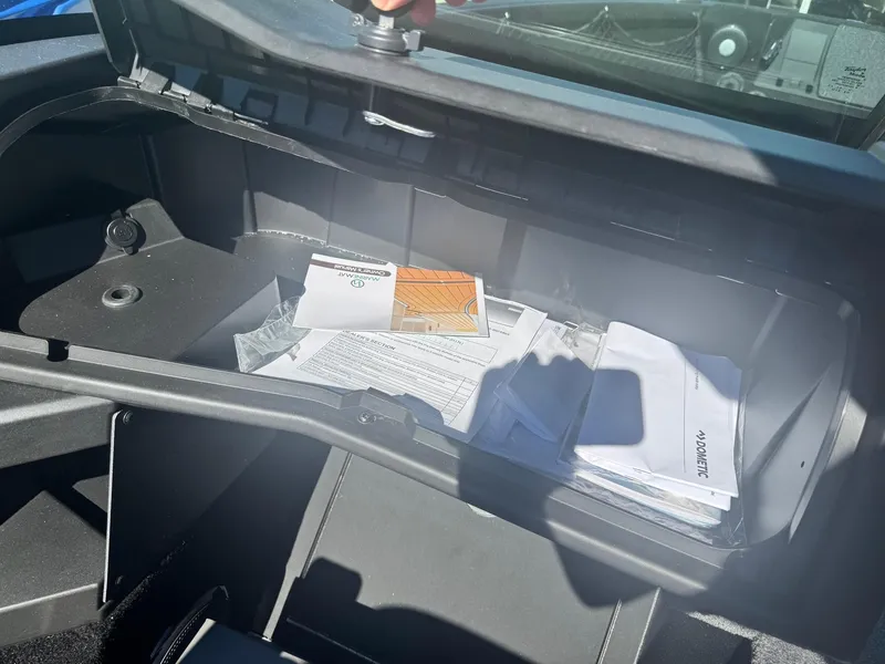 Slide: The Image of Open storage compartment of 2025 Alumacraft Trophy 185X SC Rotax S boat. - 14