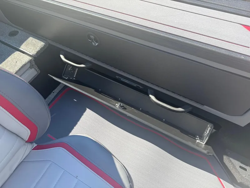 Slide: The Image of 2025 Alumacraft Trophy 185X SC Rotax S interior with open storage compartment and seating. - 17