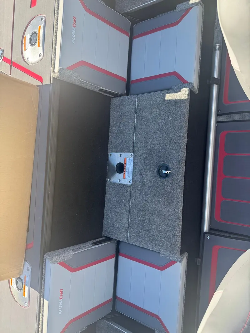 Slide: The Image of 2025 Alumacraft Trophy 185X SC Rotax S boat interior with seating and storage compartments. - 18