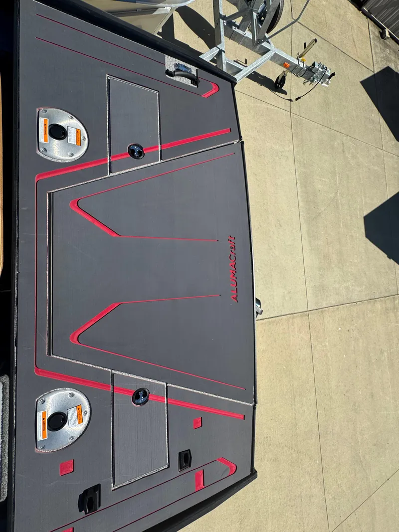 Slide: The Image of 2025 Alumacraft Trophy 185X SC Rotax S boat deck with red accents. - 25