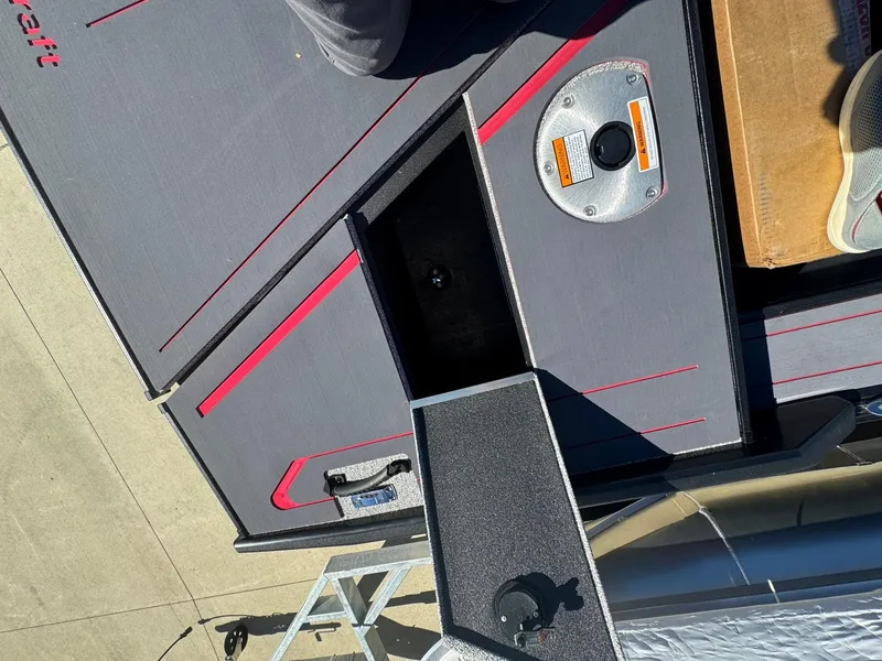 Slide: The Image of 2025 Alumacraft Trophy 185X SC Rotax S boat interior with storage compartment and sleek design. - 26