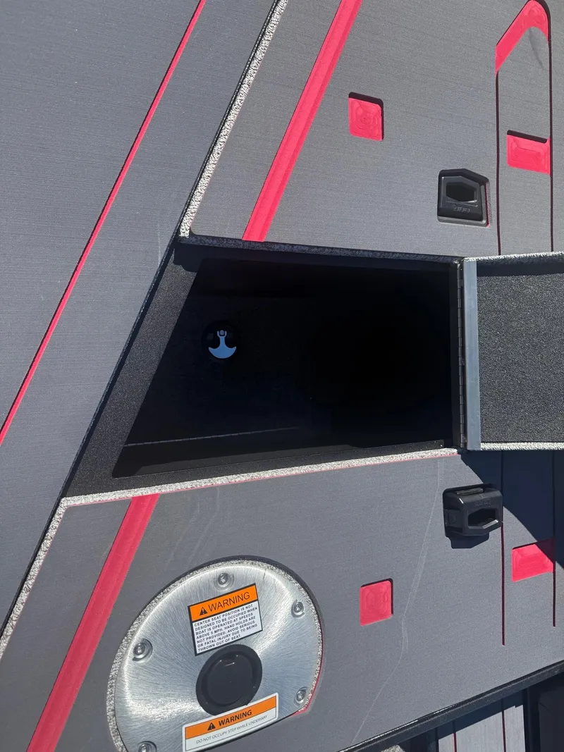 Slide: The Image of 2025 Alumacraft Trophy 185X SC Rotax S boat interior with storage compartment. - 28