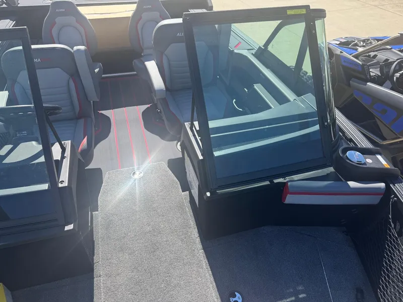 Slide: The Image of 2025 Alumacraft Trophy 185X SC Rotax S boat interior with seating and windshield. - 4