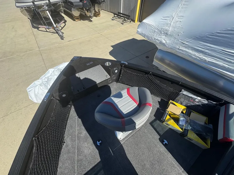 Slide: The Image of 2025 Alumacraft Trophy 185X SC Rotax S boat interior with seating and storage. - 7