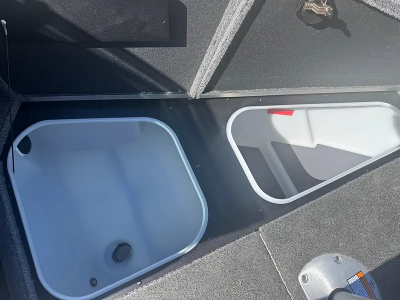 Slide: The Image of 2025 Alumacraft Trophy 185X SC Rotax S boat storage compartments. - 8