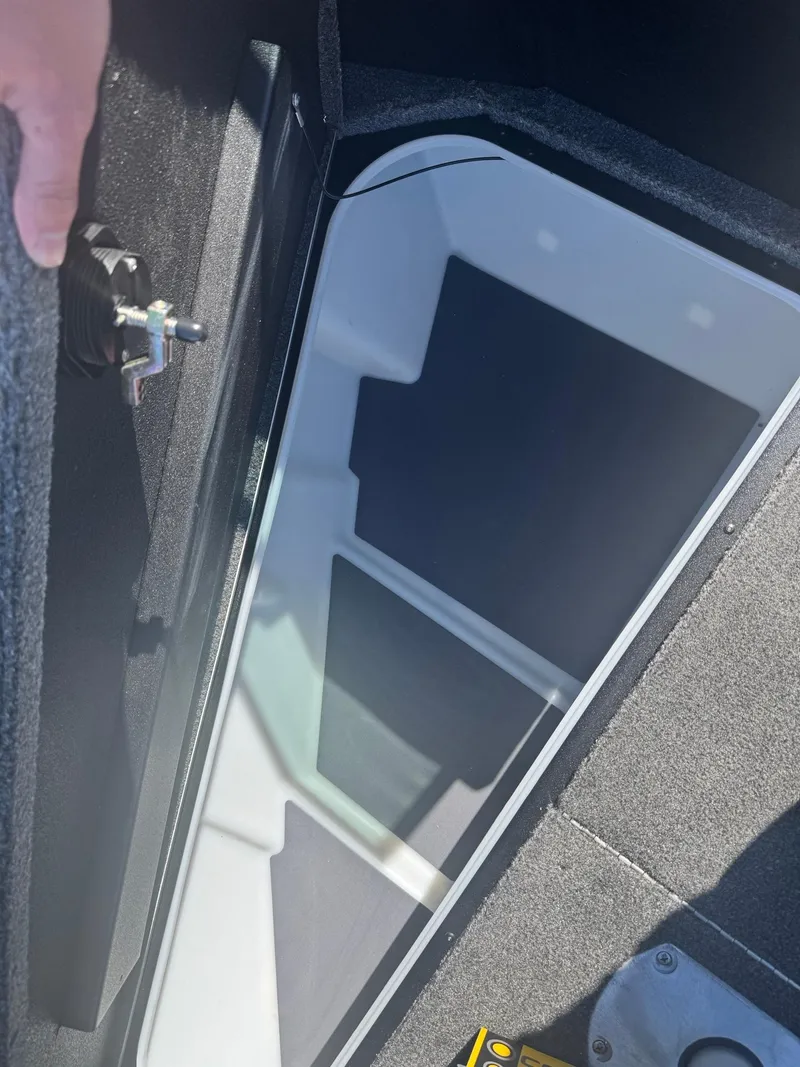 Slide: The Image of 2025 Alumacraft Trophy 185X SC Rotax S boat storage compartment interior. - 9