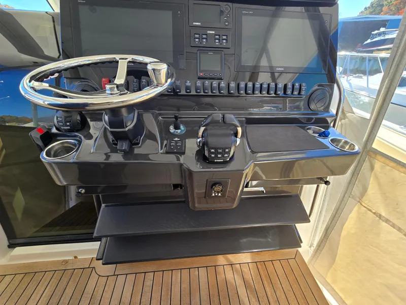 Slide: The Image of 2018 Pursuit S 408 Sport boat helm with dual screens and controls. - 17