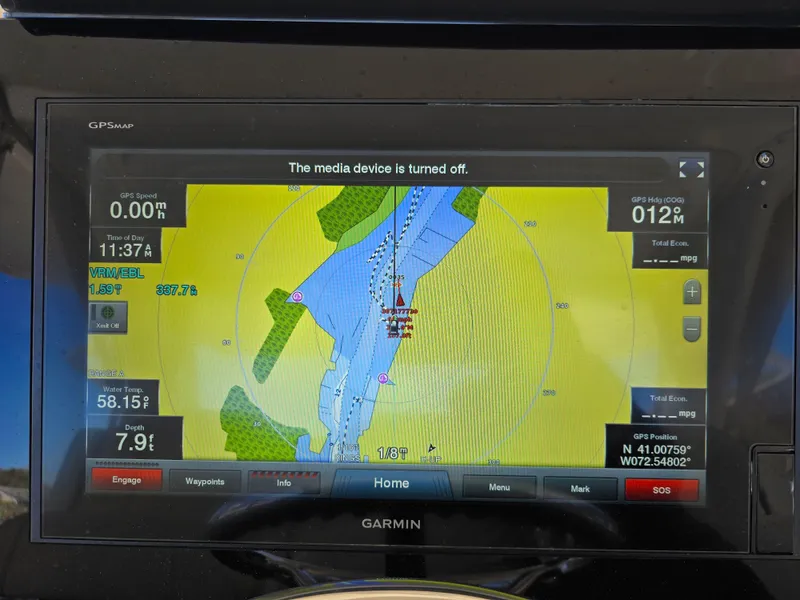 Slide: The Image of Garmin GPS display on 2018 Pursuit S 408 Sport boat, showing navigation map and coordinates. - 19