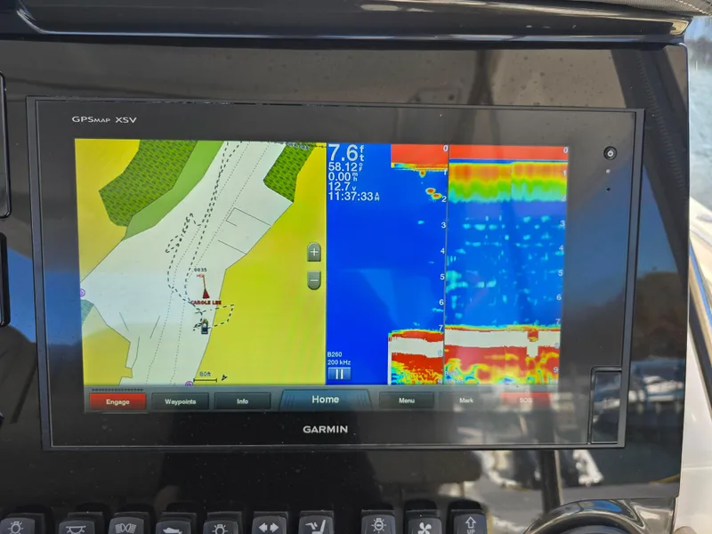Slide: The Image of Garmin GPS display on 2018 Pursuit S 408 Sport boat, showing navigation and sonar data. - 21