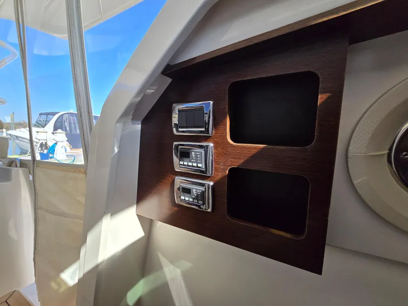 Slide: The Image of Control panel of 2018 Pursuit S 408 Sport boat with digital displays. - 24