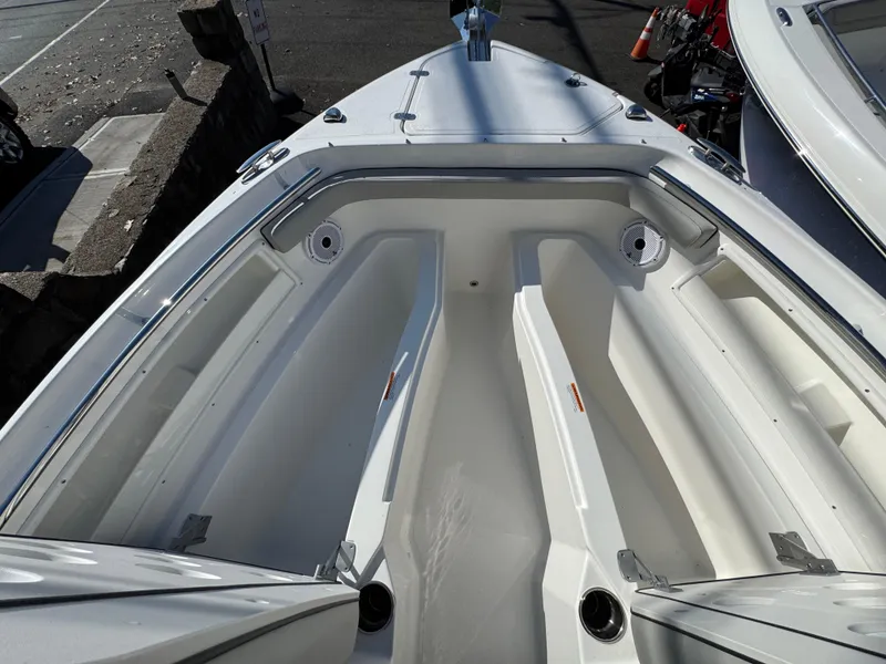 Slide: The Image of 2025 Pursuit DC 246 Dual Console boat interior with spacious seating and sleek design. - 8