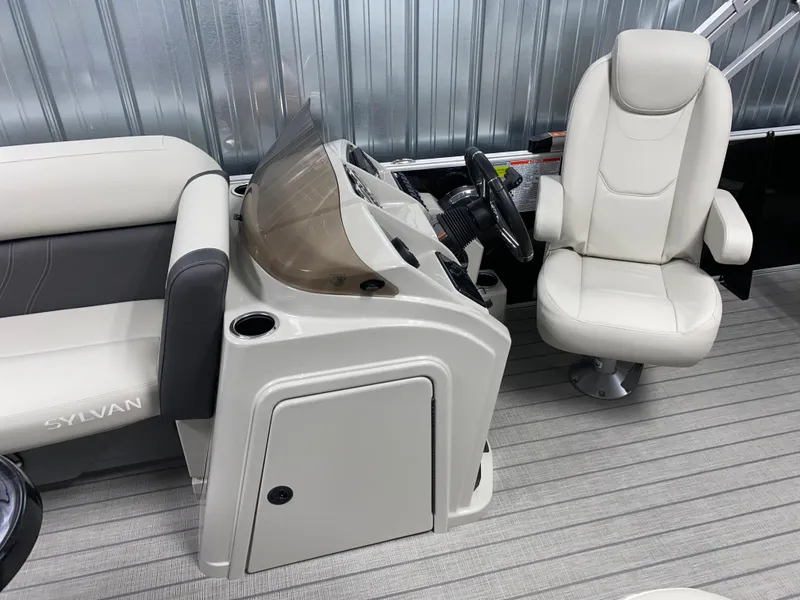 Slide: The Image of 2025 Sylvan Mirage 8520 Party Fish boat interior with helm and seating. - 10