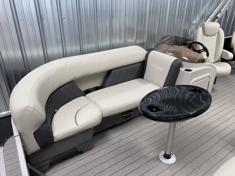 Slide: The Image of 2025 Sylvan Mirage 8520 Party Fish boat interior with seating and table. - 16