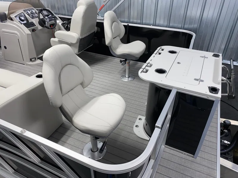 Slide: The Image of 2025 Sylvan Mirage 8520 Party Fish boat interior with seating and control panel. - 4