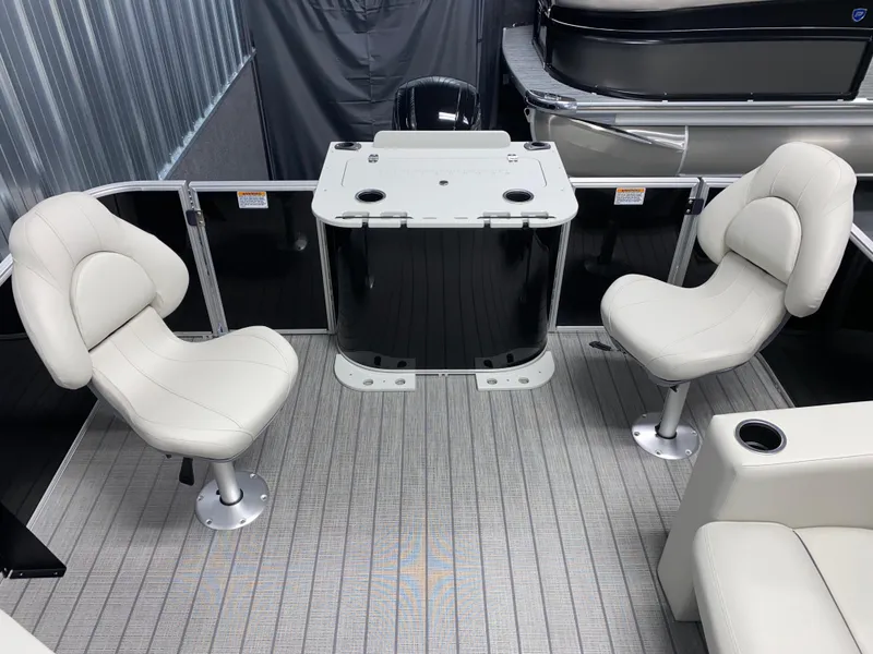 Slide: The Image of 2025 Sylvan Mirage 8520 Party Fish boat interior with seating and table. - 5