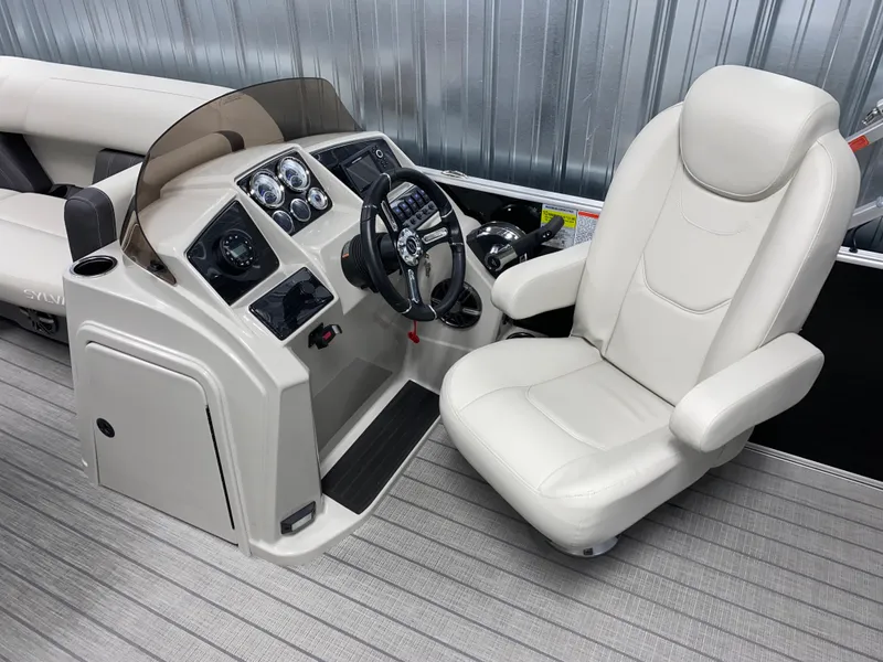 Slide: The Image of 2025 Sylvan Mirage 8520 Party Fish boat interior with steering console and captain's chair. - 9