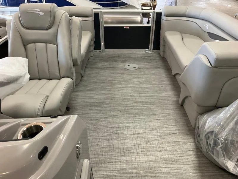 Slide: The Image of 2023 Bennington 21SSR pontoon boat interior with gray seating and flooring. - 11