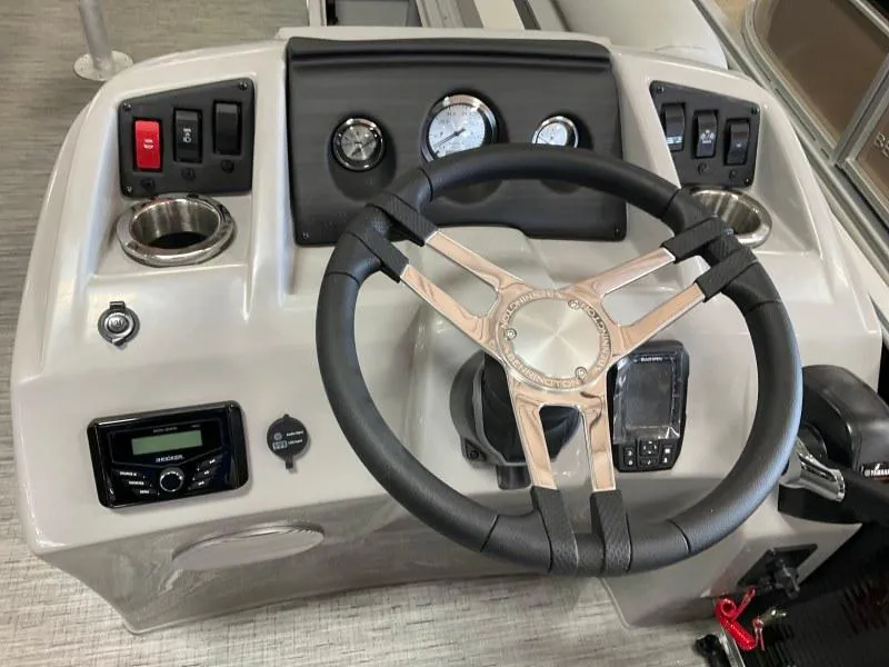 Slide: The Image of 2023 Bennington 21SSR boat dashboard with steering wheel and control panel. - 14