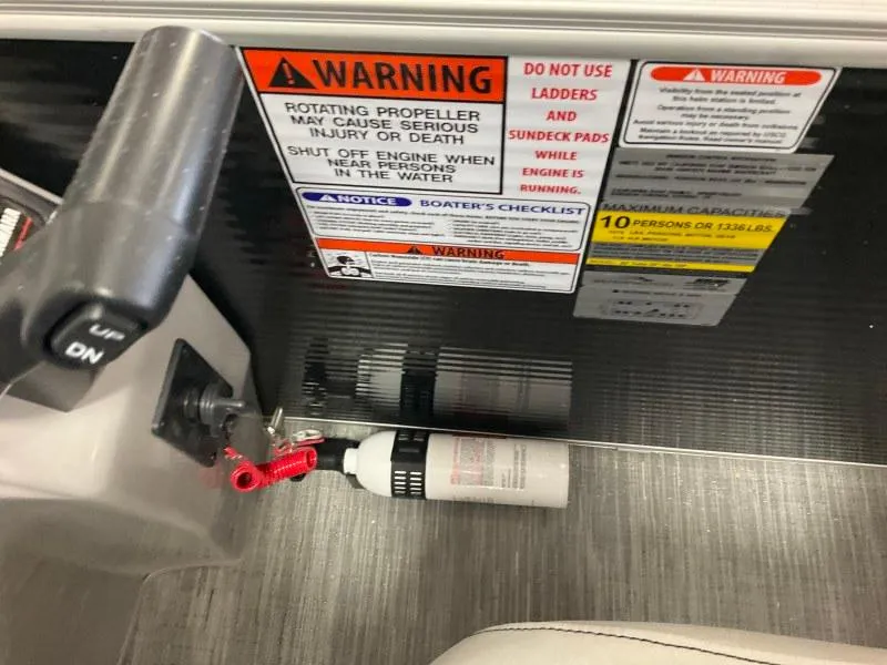 Slide: The Image of 2023 Bennington 21SSR boat warning labels and safety instructions near control panel. - 15