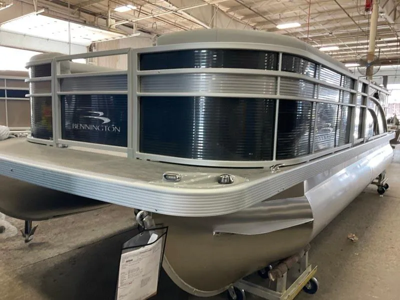 Slide: The Image of 2023 Bennington 21SSR pontoon boat in a warehouse setting. - 4