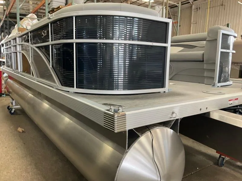 Slide: The Image of 2023 Bennington 21SSR pontoon boat in a warehouse setting. - 7