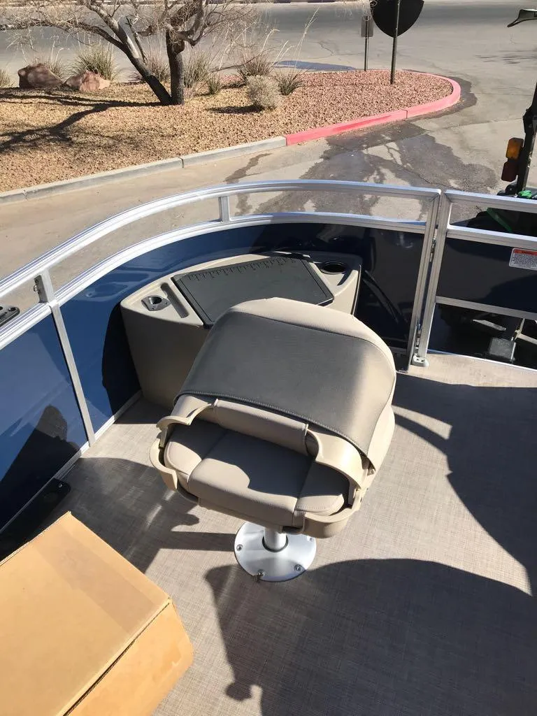 Slide: The Image of 2025 Sun Tracker Fishin' Barge 20 DLX boat with swivel seat and railing. - 12